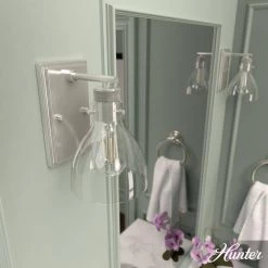 Van Nuys 1 Light Brushed Nickel Wall Sconce with Clear Glass Shade Bathroom Light by Hunter -Hunter Sales brushed nickel hunter vanity lighting 19300 e1 1000
